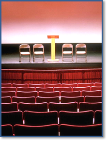 An auditorium is used for a budget briefing.