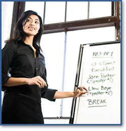 A Manager uses an easel pad for a presentation.